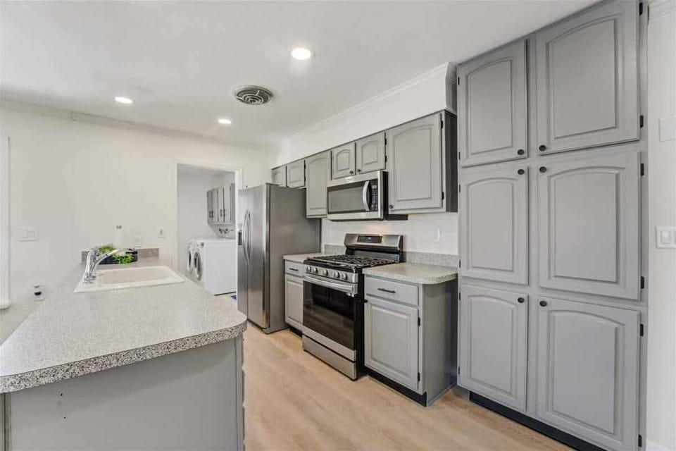 Open concept kitchen has everything you need to make great meals or grab a quick snack and not miss any of the action !