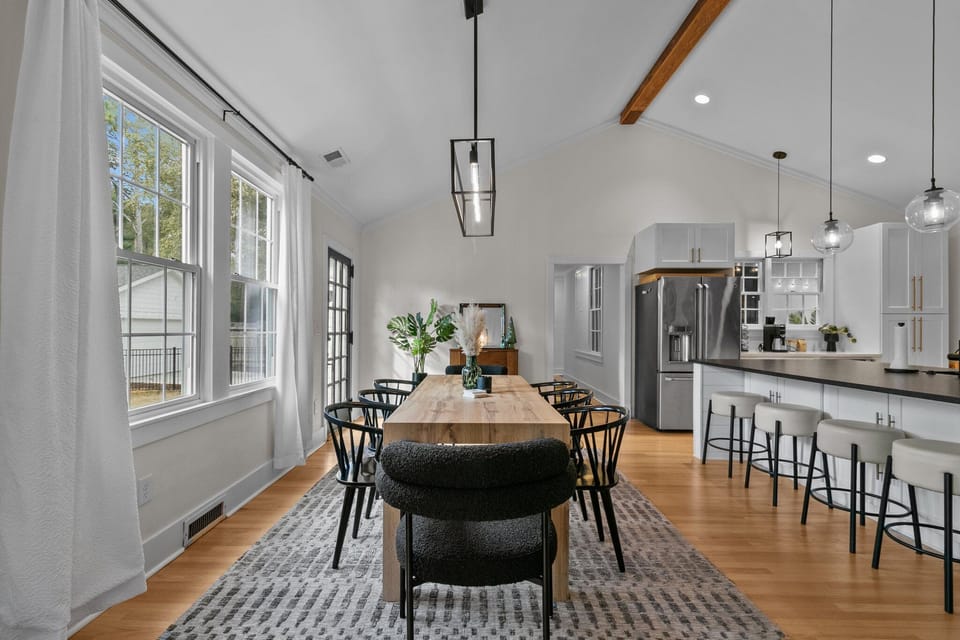 Large dining table and eat-at island. Plenty of seating for all.