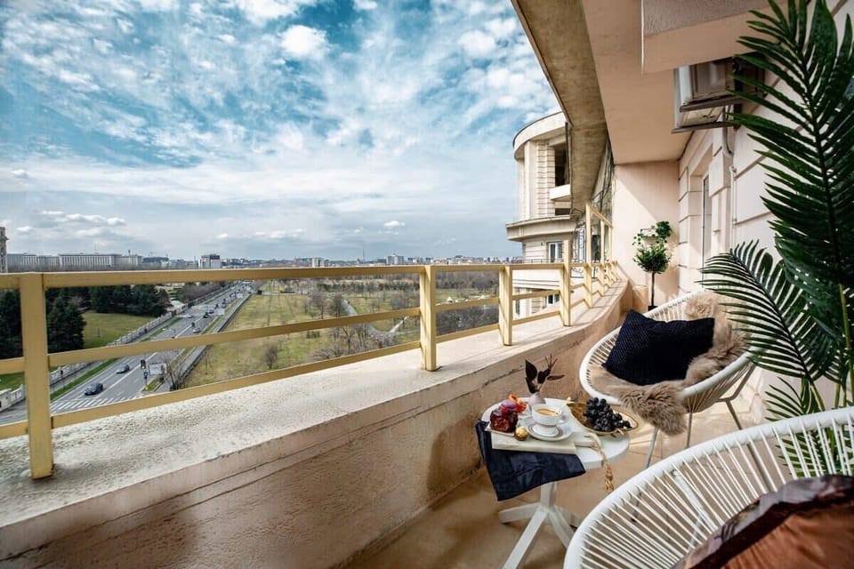 Savor stunning vistas from our balcony, with the iconic Palace of the Parliament as your backdrop.