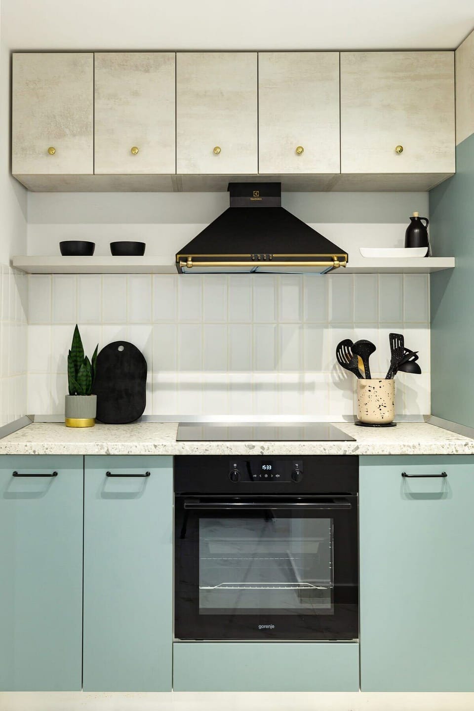 Elevate your cooking experience in our luxurious kitchen, where sleek modern design meets refreshing dry creek turquoise accents, creating a vibrant yet elegant ambiance.