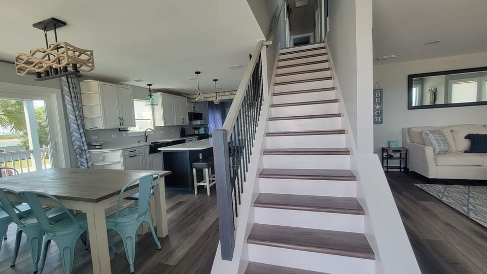 Entering the Front Door, to the left is the expansive kitchen, to the right is the 1st famiyroom