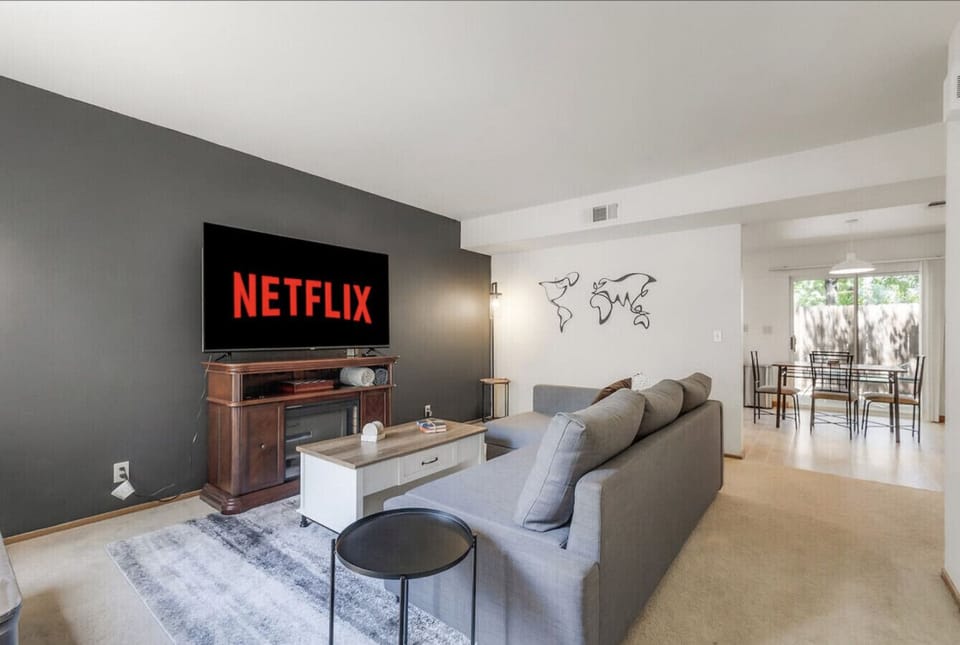 Relax in the cozy living room featuring a smart TV with Netflix.