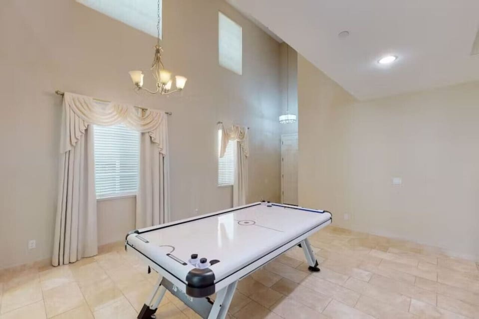 Spacious game room perfect for family fun.