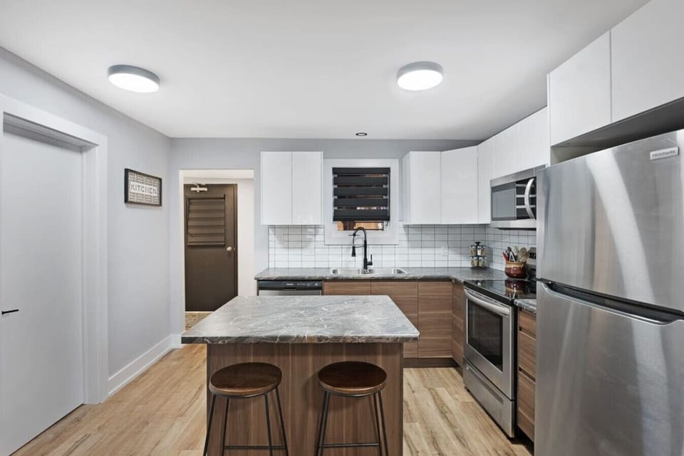 Elevate your cooking and entertaining game with this chic modern kitchen island. Featuring a multi-functional island that doubles as an eating area, workstation, and food prep space. Sleek lines, contemporary finishes, ample countertops, and storage!