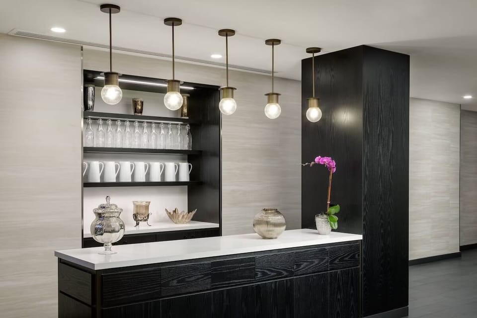 Sip a fresh coffee beneath warm lighting in the lobby.
