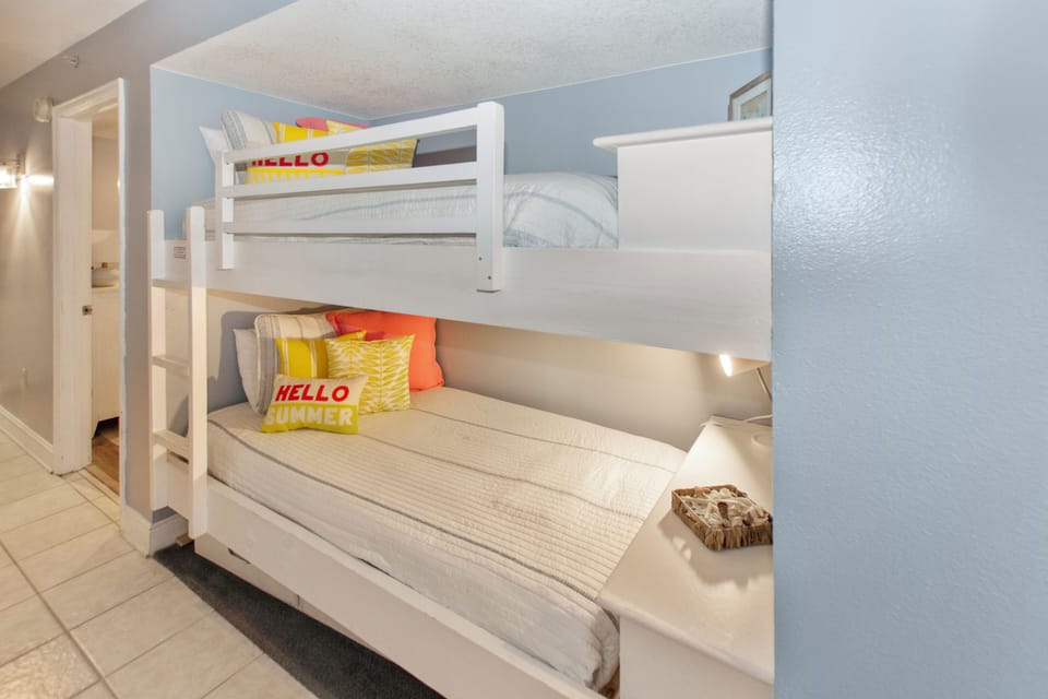 Your family's perfect retreat features cheerful built-in bunk beds, creating cozy sleeping nooks.