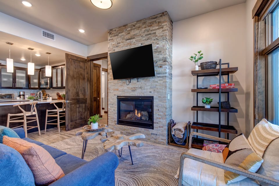 Living area with a smart TV and cozy gas fireplace