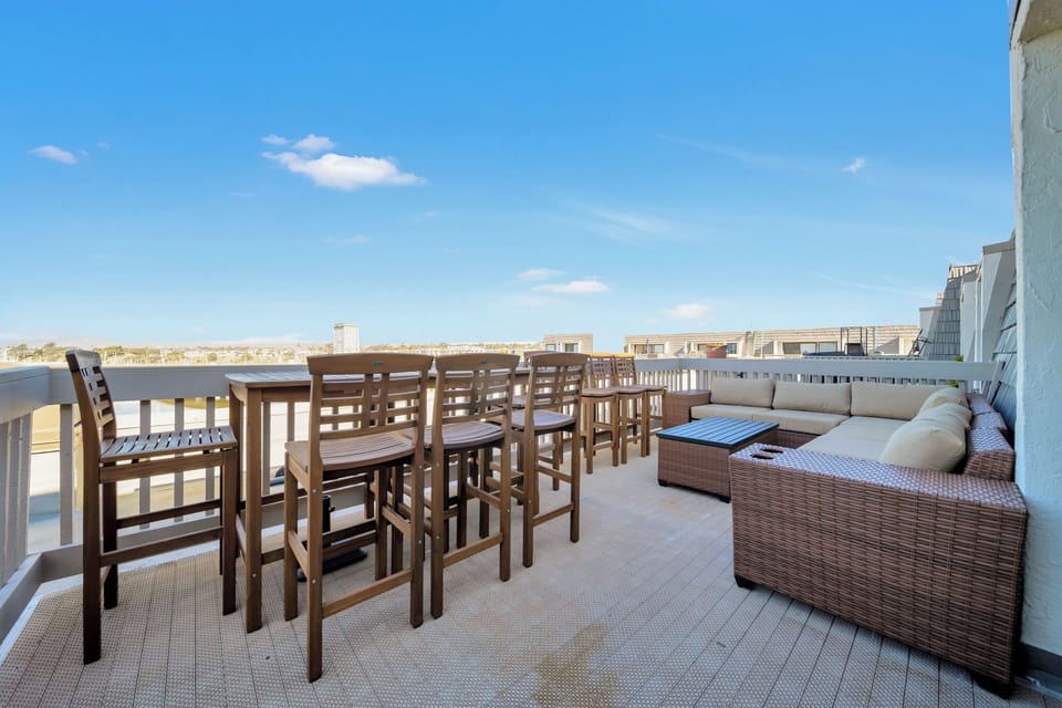 Large upper balcony with plenty of seating to enjoy your morning coffee and watch the waves