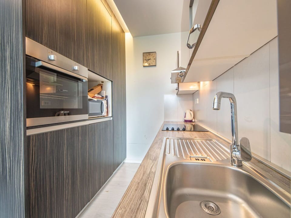 Kitchen Sink, Sink, Tap, Countertop, Plumbing Fixture, Cabinetry, Wood, Interior Design, Lighting, Kitchen