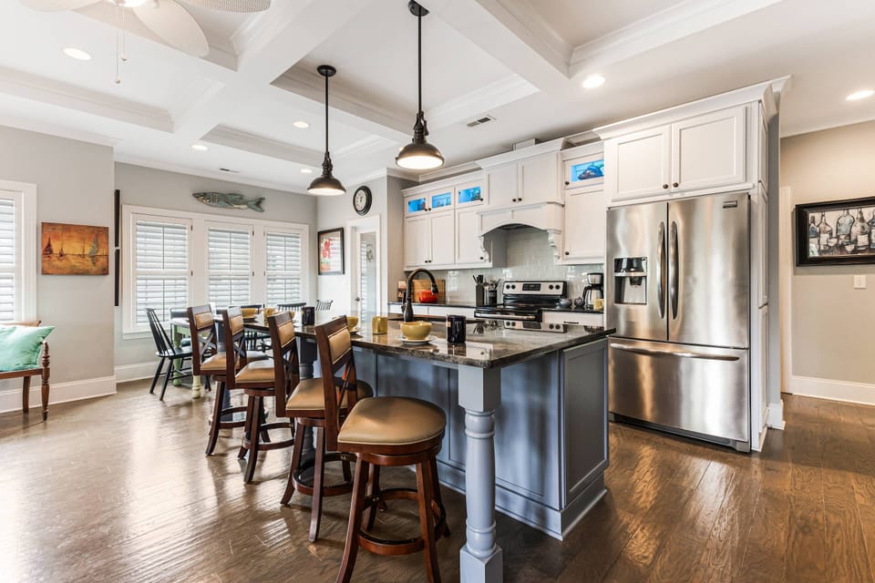 You may choose to sit at one of the 4 seats at the kitchen island. This space is perfect for mobile work/school, playing games & assembling puzzles.