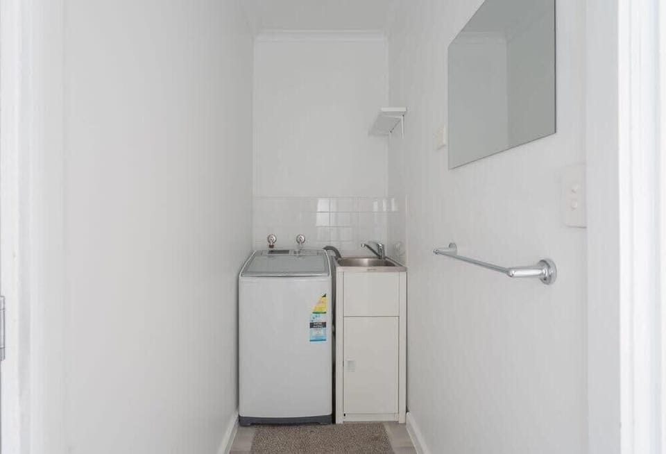Enter into the laundry and separate toilet