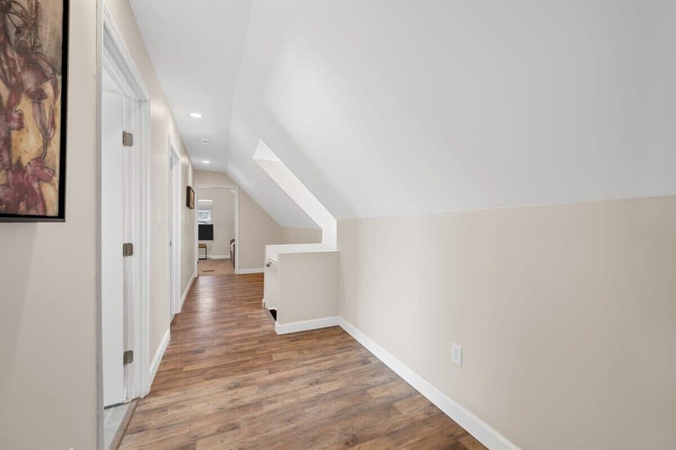 Welcome to the 3rd floor...Embracing the elegance of simplicity in this stunning hallway.  #MinimalistChic #HardwoodHaven