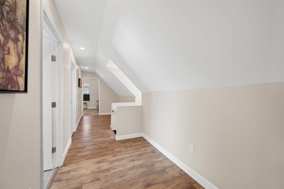 Welcome to the 3rd floor...Embracing the elegance of simplicity in this stunning hallway.  #MinimalistChic #HardwoodHaven