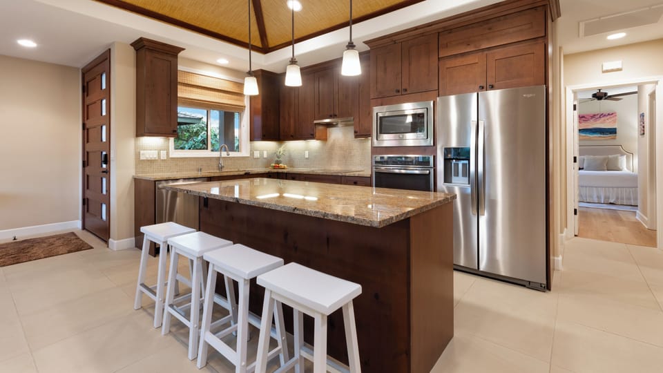 High end Gourmet Kitchen with a great assortment of spices and oils provided