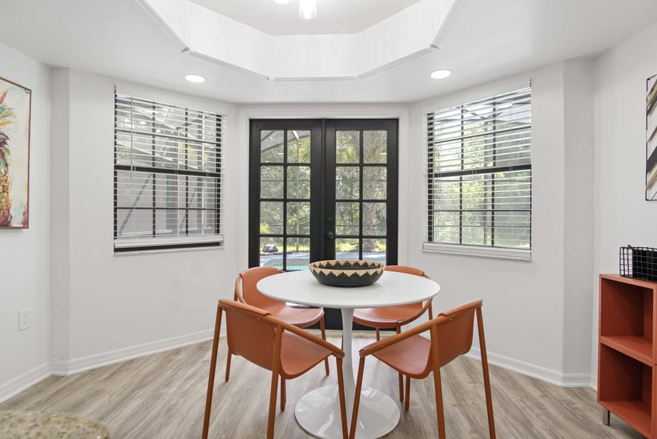 Charming dining area for four in the kitchen, ideally situated by the pool entrance.