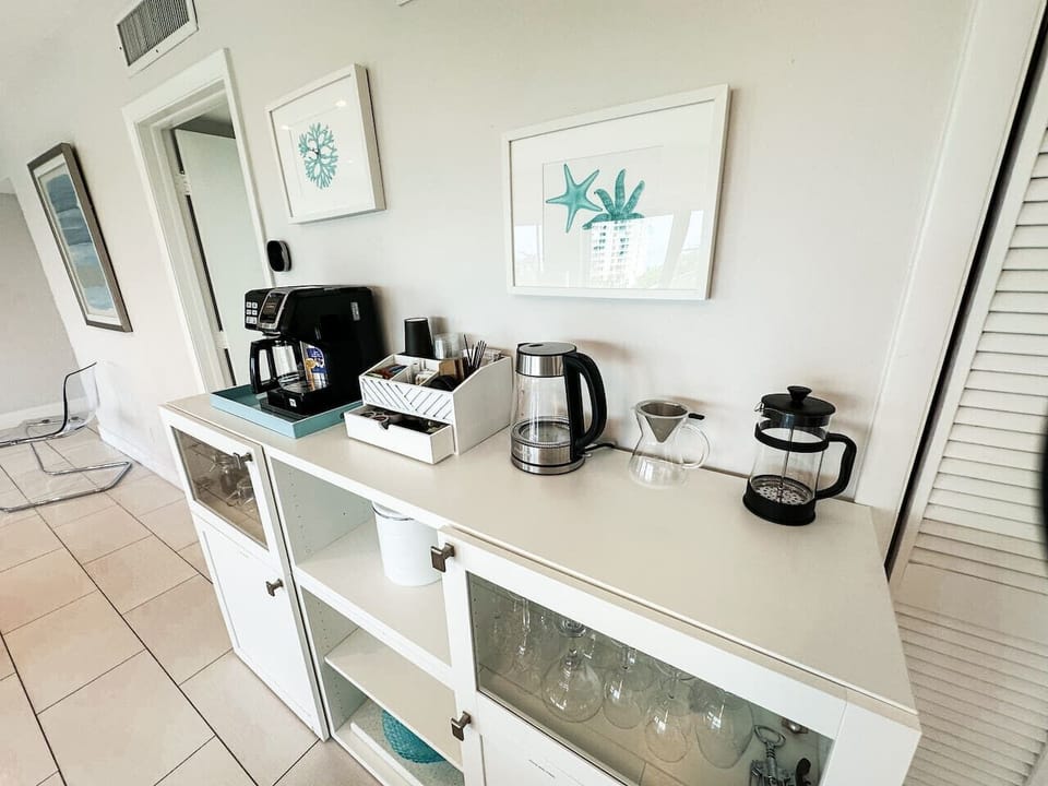 Coffee station with carafe/k-cup machine, French press, pour over drip coffee and tea kettle.  I provide an assortment of coffee and tea accompaniments.