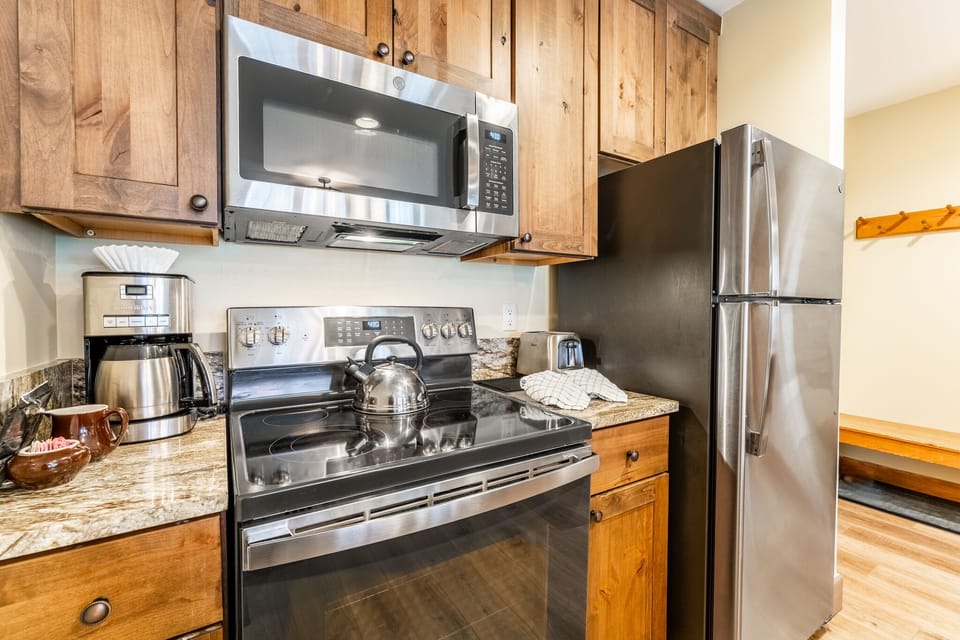 Full size kitchen featuring modern stainless steel appliances