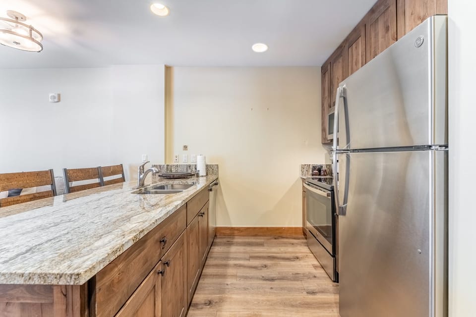 Full size kitchen featuring modern stainless steel appliances