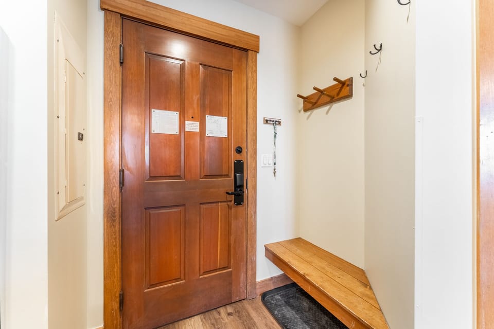 Unit entryway with hooks and bench