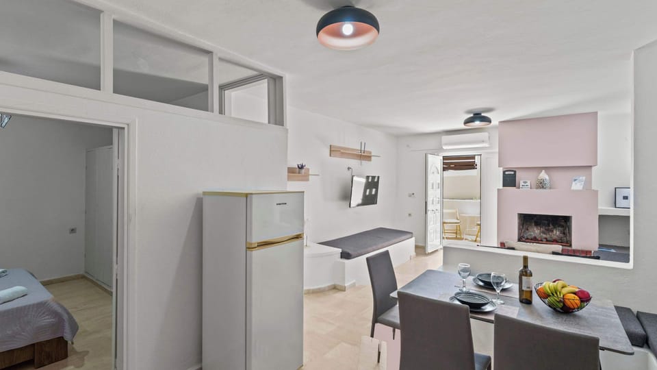 Spacious open-plan interior connecting sofa lounge, kitchen and terrace

