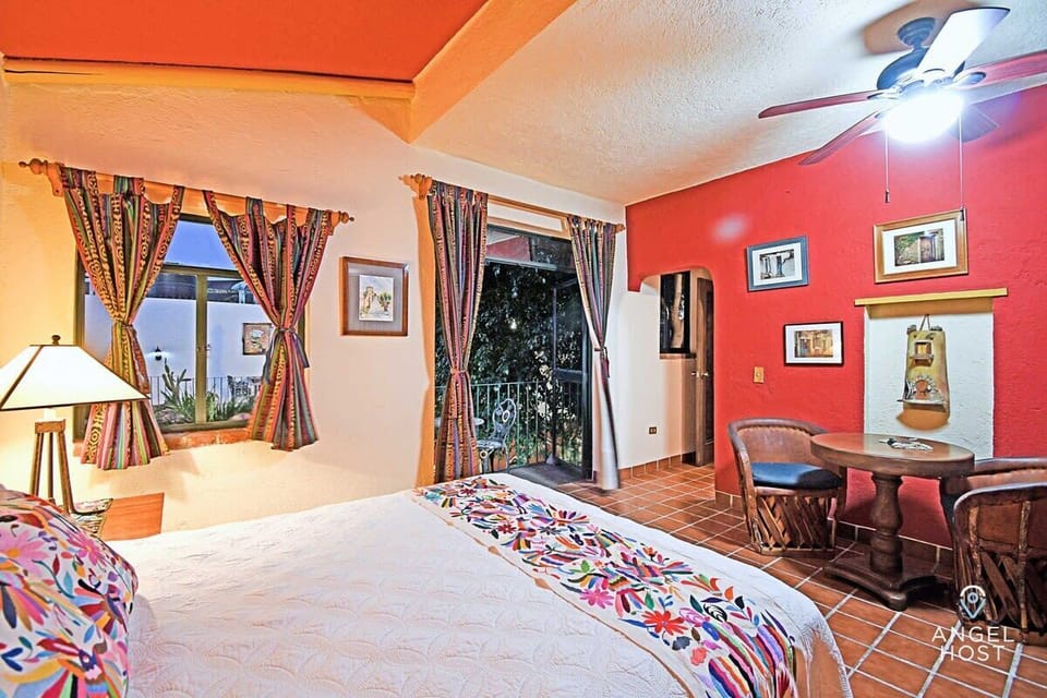 Stay cool and comfortable with A/C, a ceiling fan, and room-darkening curtains.