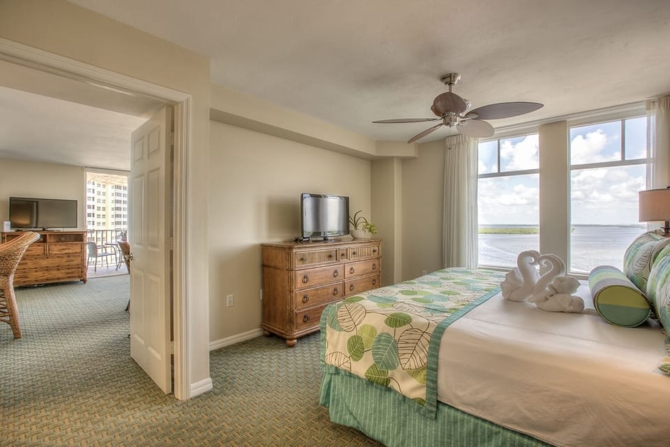 Drift off comfortably with ocean light pouring through tall windows.