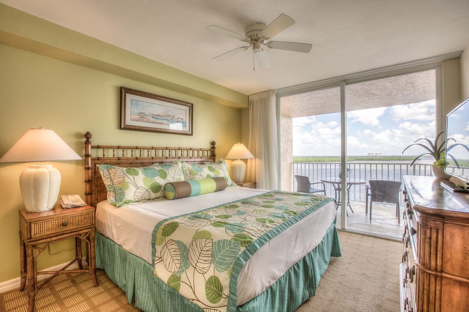 Wake up to sweeping water views from a serene king bed.