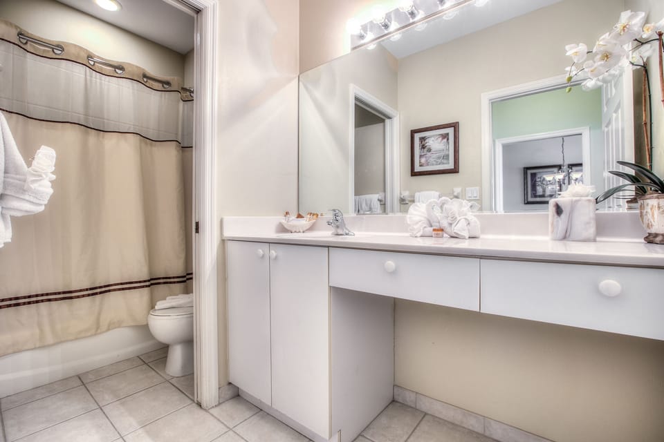 Refresh with fluffy towels and a clean, bright vanity.