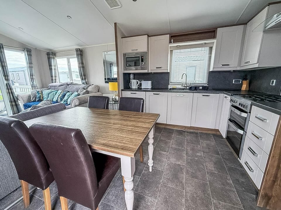 Discover the beauty of British staycations with caravan holidays Suffolk at Broadland Sands Holiday Park Lowestoft, featuring comfortable caravans with an inviting kitchen area for your convenience.