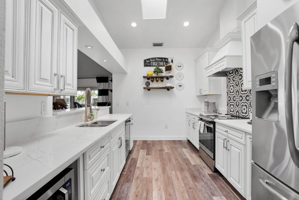 Opposite end of kitchen leading to family room