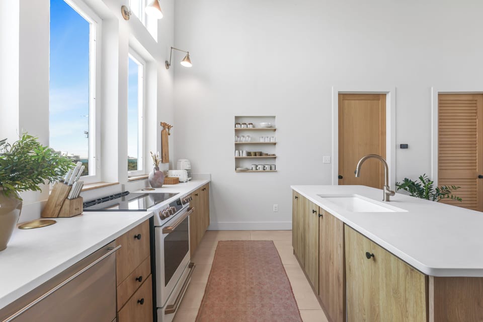 The chef inspired kitchen features Smeg appliances and an induction cooktop. 