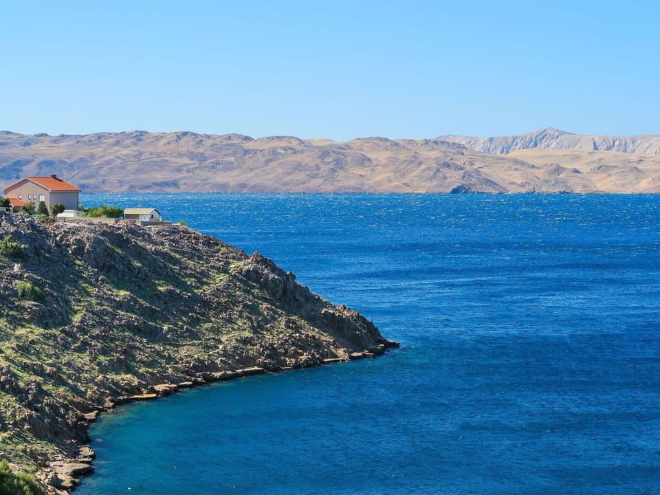 Water, Sky, Mountain, Azure, Coastal And Oceanic Landforms, Body Of Water, Natural Landscape, Lake, Terrain, Landscape