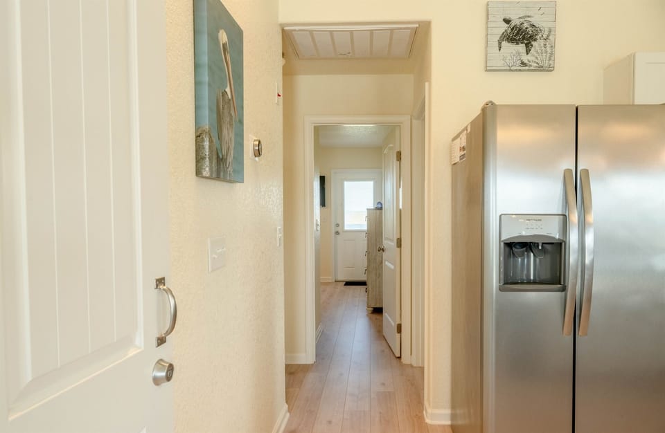 Spacious hallway provides easy access to all 3 bedrooms, bathroom #3 and washer/dryer