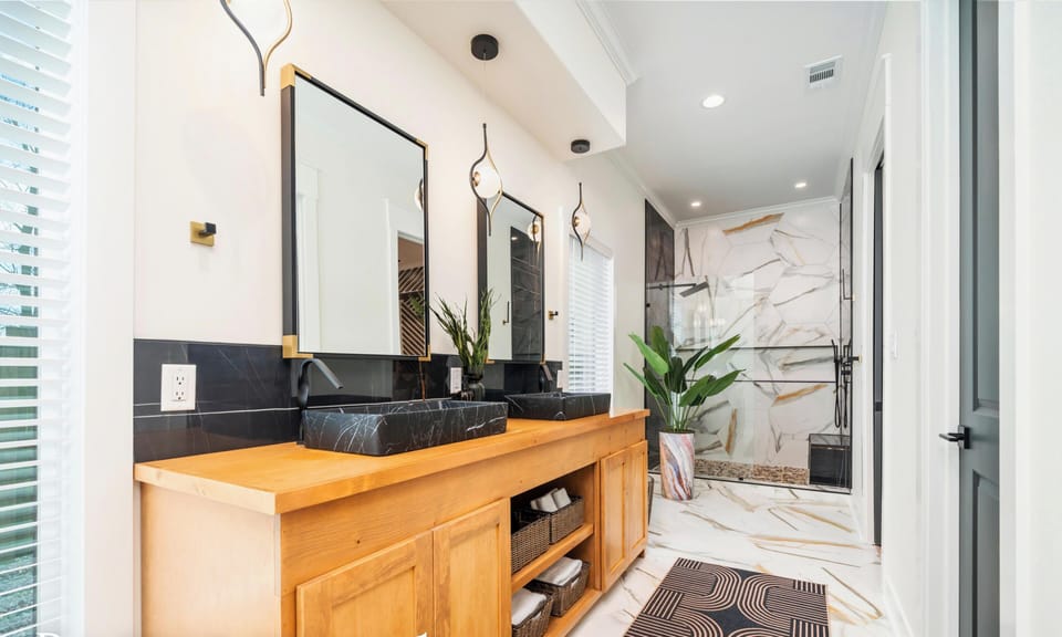Double sinks and plenty of counter space make getting ready easy while maintaining a sleek, modern feel.