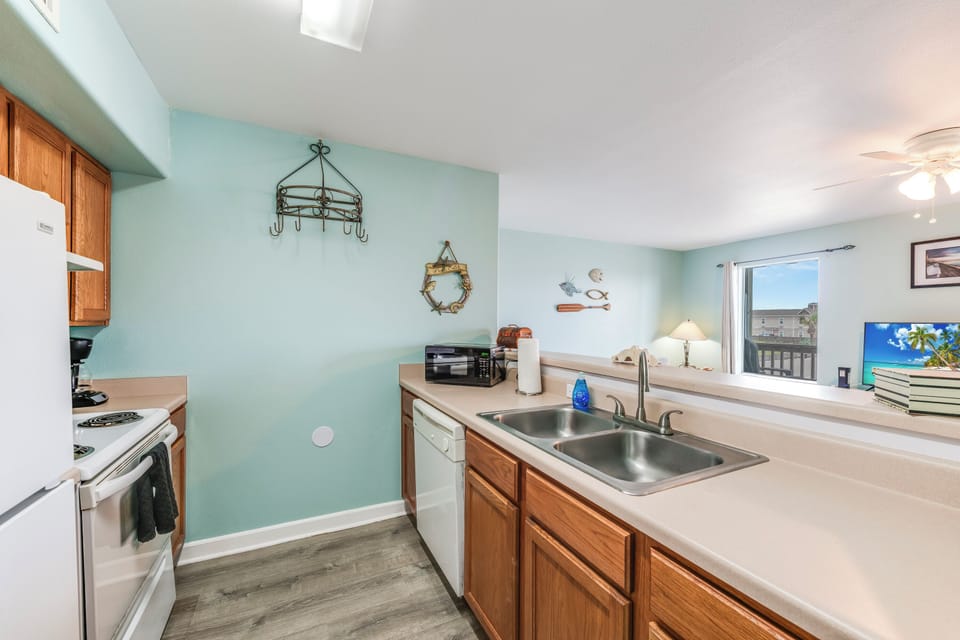 Open-concept layout connects the living room, dining area, and kitchen, creating a warm and inviting space perfect for gatherings and making lasting memories.