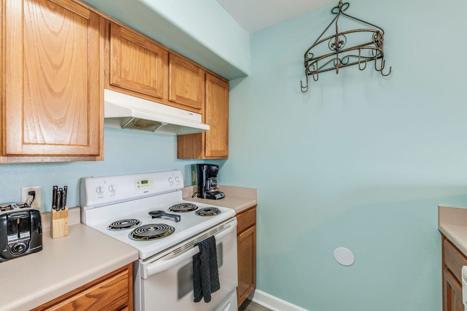 Cozy and functional kitchen with all the essentials for a perfect beachside stay! ☕🍳