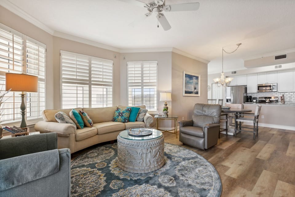 Living Area with Stunning Oceanfront Views, Flat Screen TV, and Balcony Access