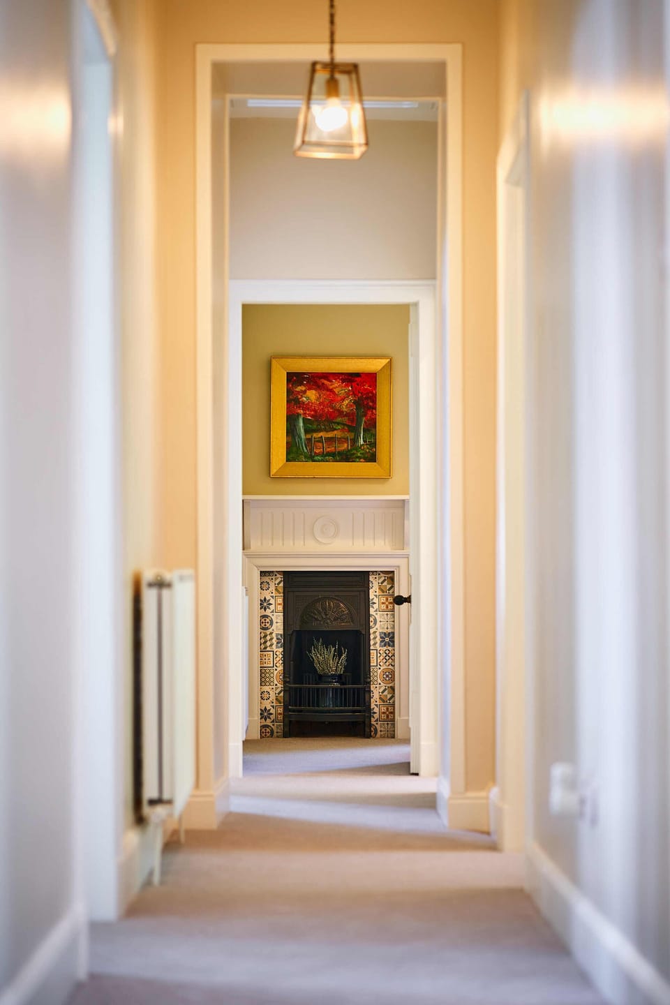 Beech bedroom traditional fireplace and original painting of surrounding trees.