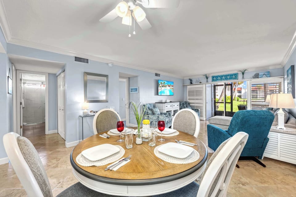 Open-Concept Living & Dining – Formal dining table with seating for six, additional breakfast bar stools for even more flexible seating