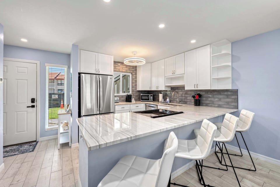 Open-Concept Living & Dining – Breakfast bar for additional seating arrangements