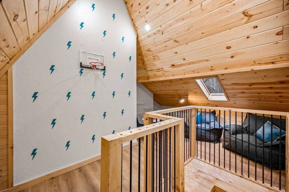 The kids hangout - the loft area with comfortable seating and a basketball goal!
