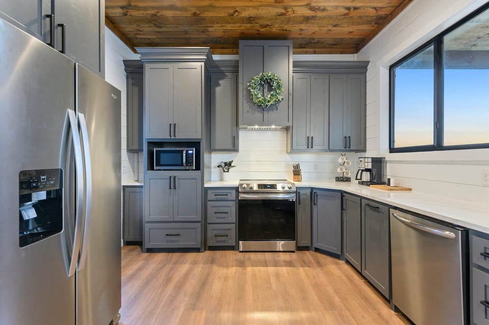 The kitchen is equipped with all of the stainless steel appliances you need!