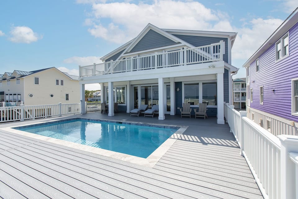 Great pool deck with salt water pool and gorgeous view of the ocean.