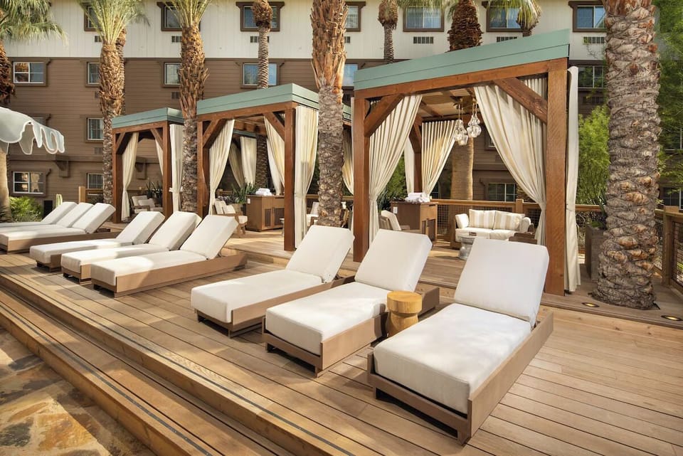 Unwind on shaded cabanas with plush loungers and palm breezes.