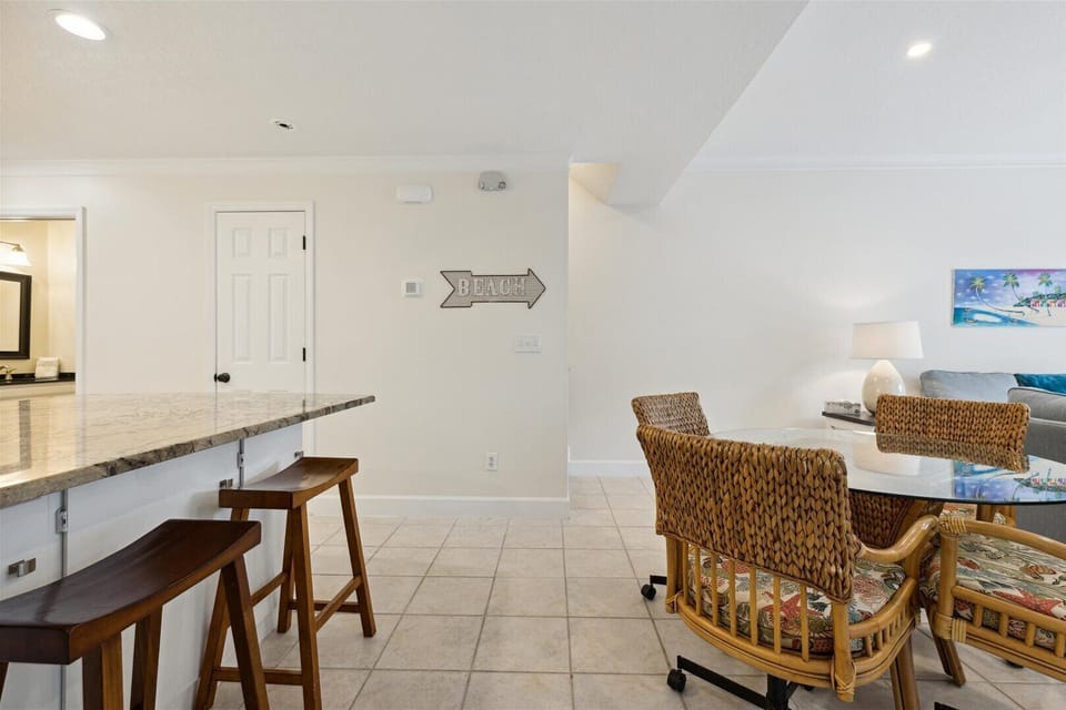 Spacious kitchen island with barstools, ideal for casual dining and chats.