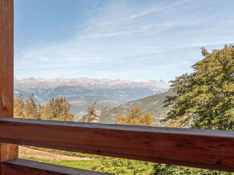 Sky, Building, Property, Table, Furniture, Cloud, Mountain, Interior Design, Outdoor Furniture, Wood