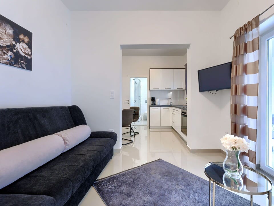 Furniture, Property, Comfort, Picture Frame, Interior Design, Couch, Living Room, Flooring, Floor, Wood
