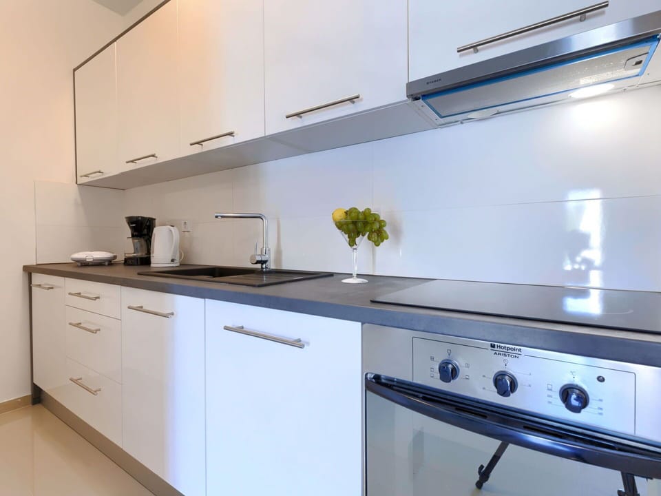Cabinetry, Property, Countertop, White, Kitchen Appliance, Kitchen Stove, Kitchen, Home Appliance, Interior Design, Drawer