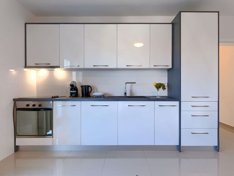 Cabinetry, Countertop, Property, Kitchen Appliance, Kitchen Stove, Kitchen, Home Appliance, Kitchen Sink, Tap, Interior Design