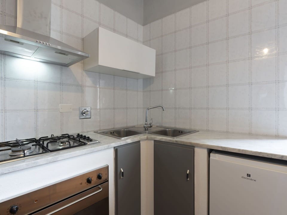 Sky, Plant, Cloud, Street Light, Urban Design, Road Surface, Tree, Building, Landscape, Road